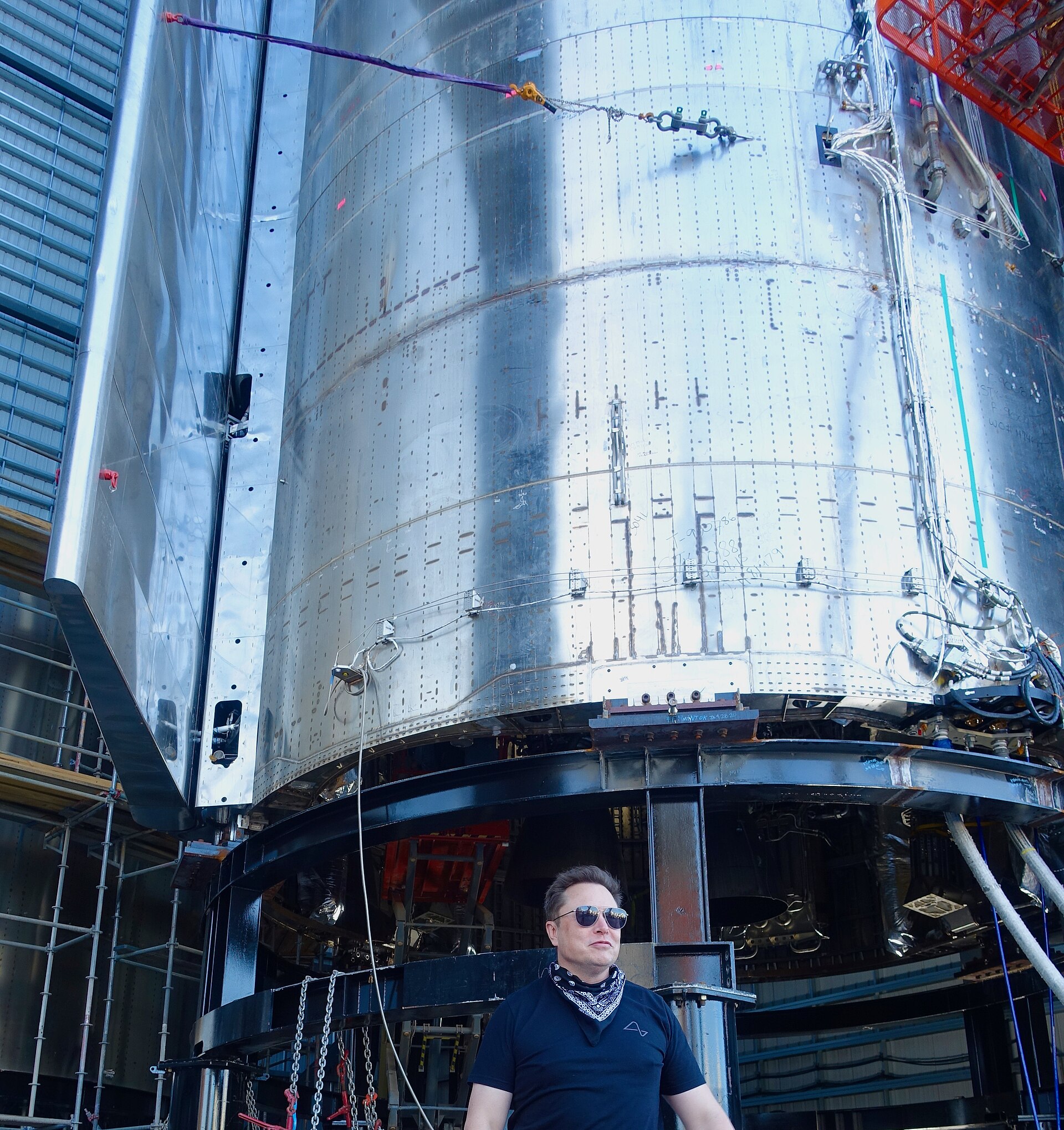 SpaceX CEO Elon Musk stands beneath a Starship vehicle at the company's Texas site in December 2020.