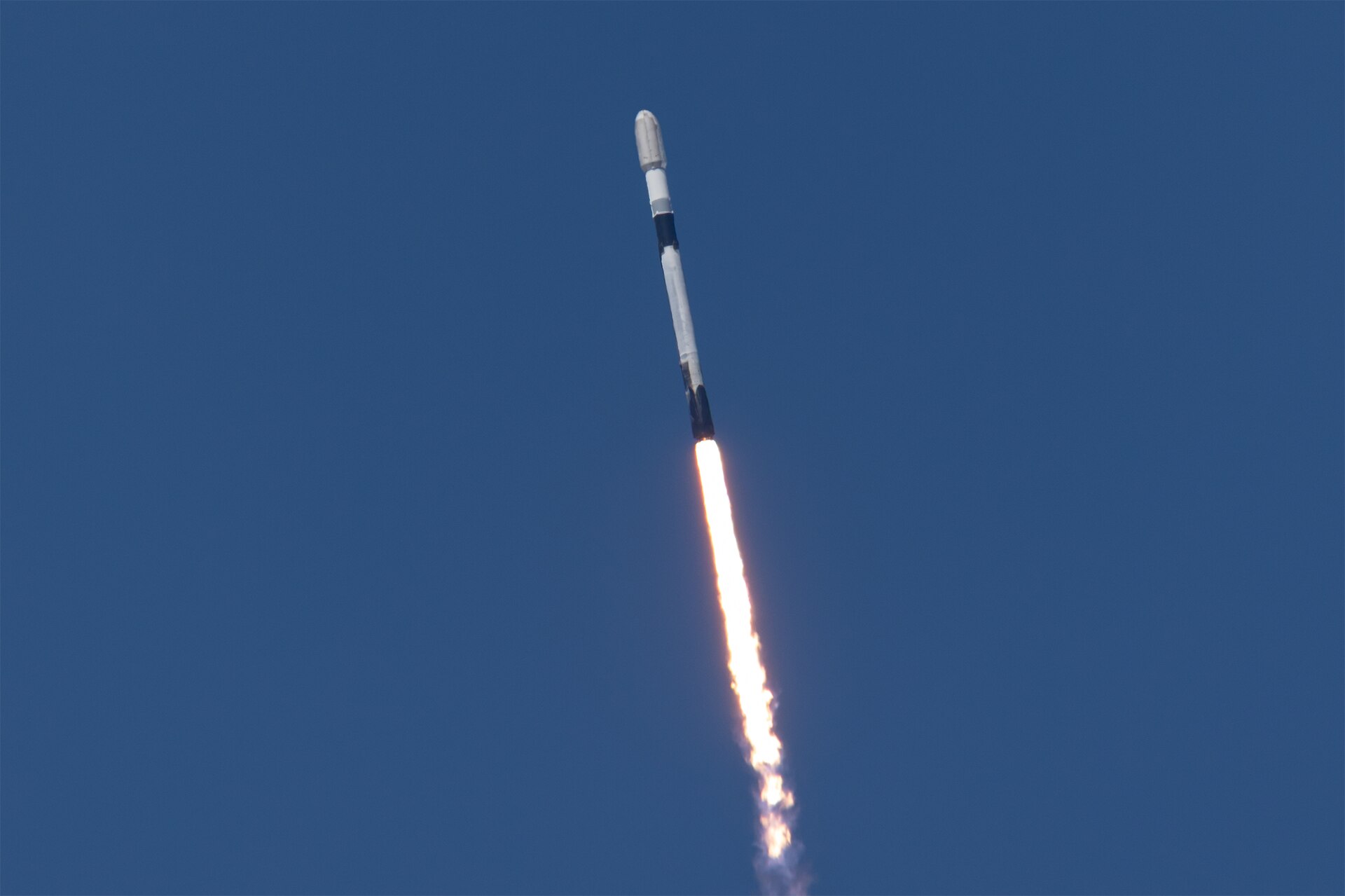 A SpaceX Falcon 9 climbs from Vandenberg Space Force Base on Oct. 1, 2026, on the Transporter-18 rideshare that carried Cowboy Space's Reason-1 satel…