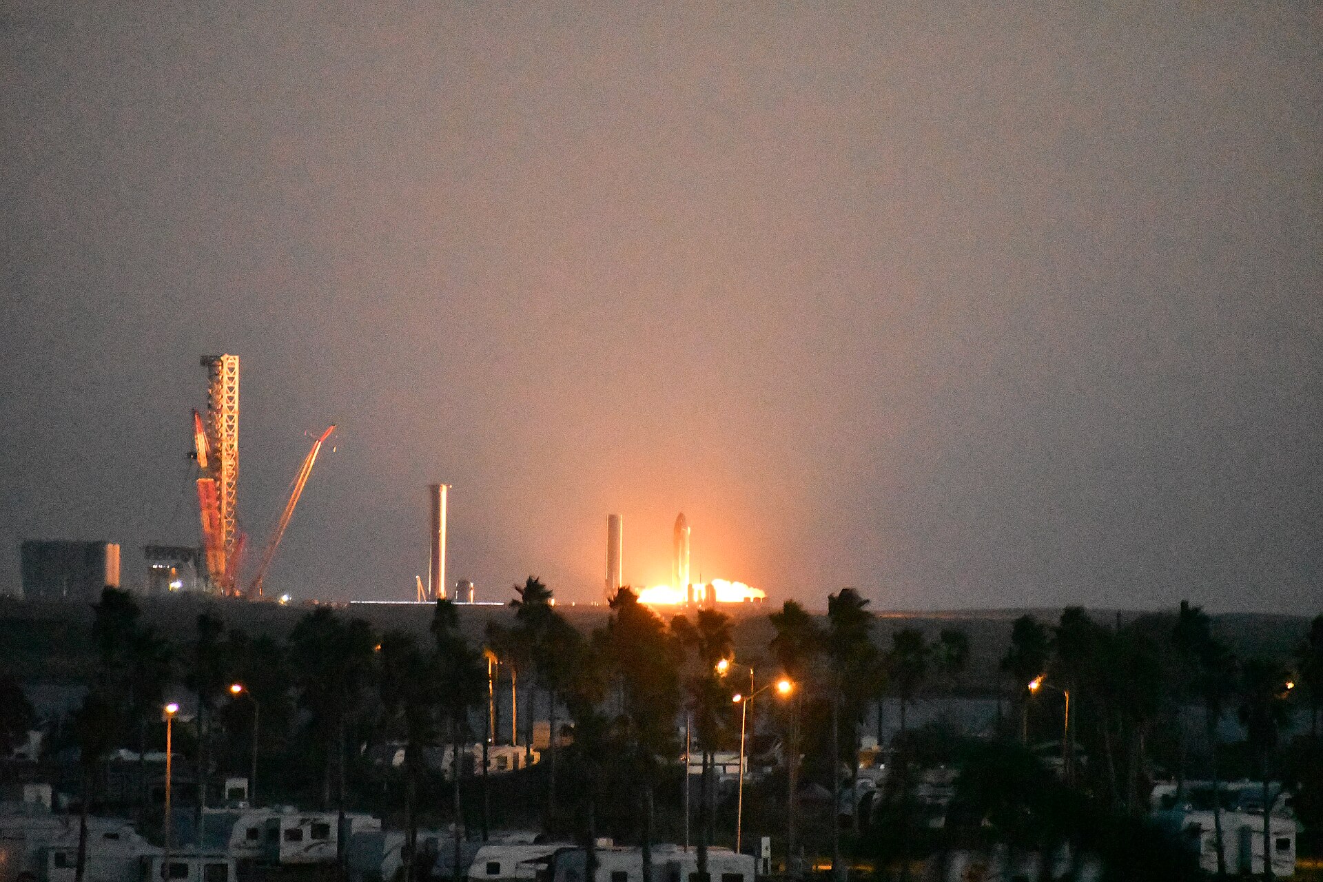 Starship SN20 fires its engines in a static-fire test at Starbase, Texas, on Oct. 21, 2021, seen from South Padre Island.