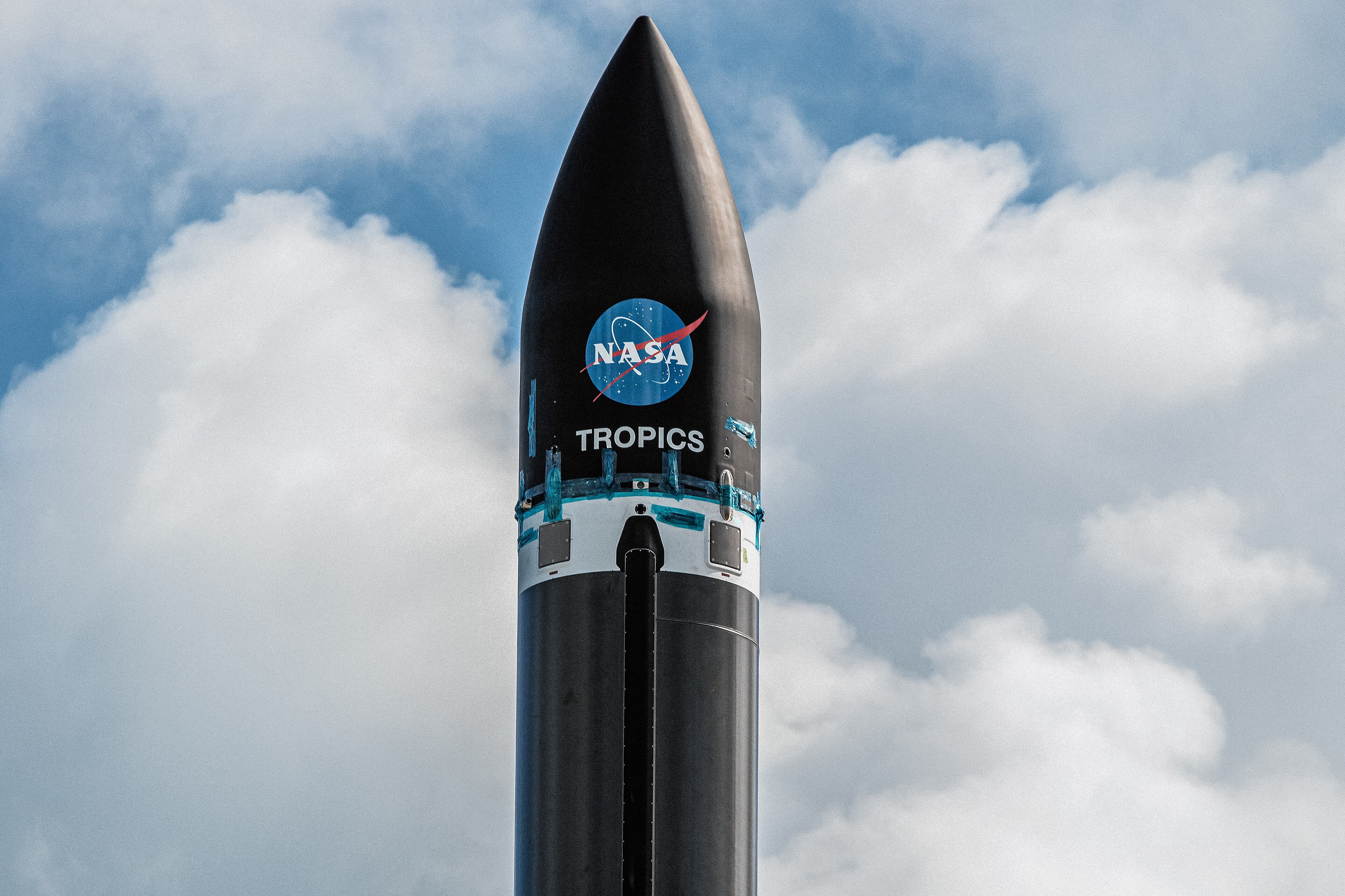A Rocket Lab Electron rocket stands vertical on the pad at Launch Complex 1 in Māhia, New Zealand, ahead of a NASA TROPICS mission launch.