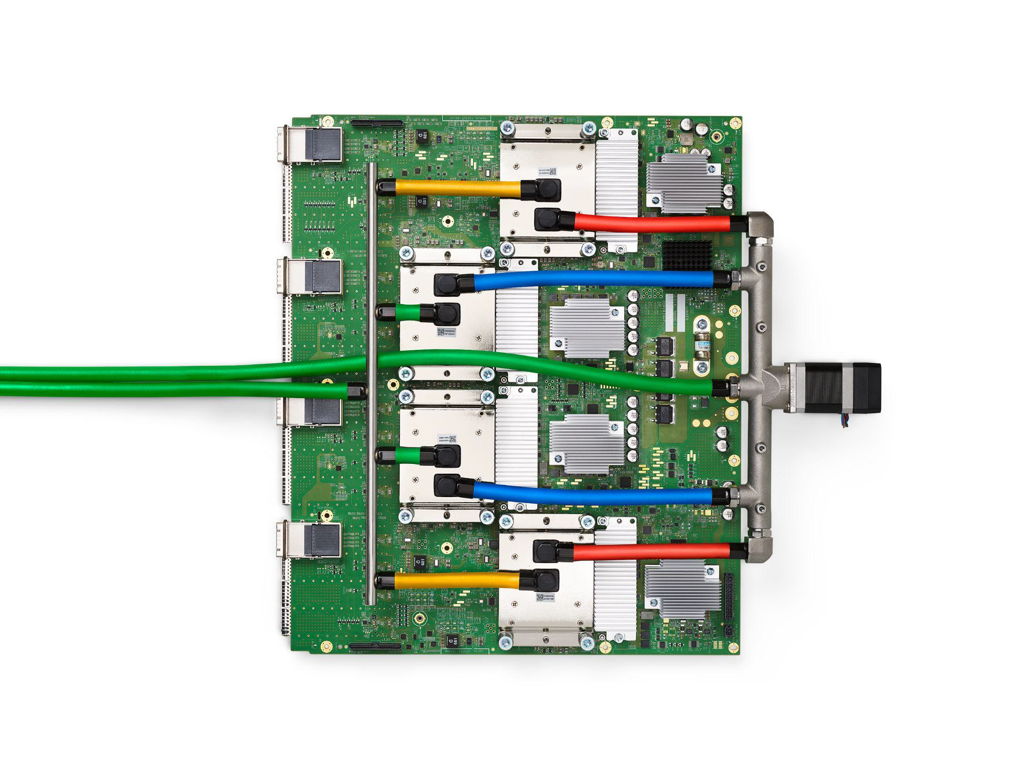 A Google TPU v4 printed circuit board with four liquid-cooled packages, each holding an ASIC and HBM stacks.